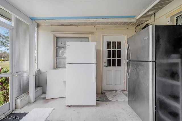 kitchen with white fridge and stainless steel refrigerator