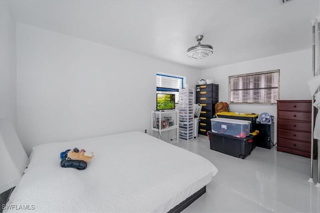 bedroom featuring concrete floors