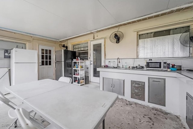 view of patio / terrace with an outdoor kitchen and sink