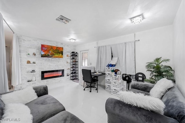 office area featuring a stone fireplace