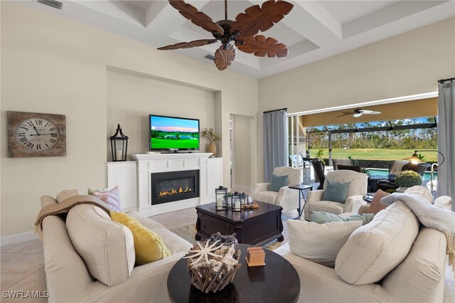 tiled living room featuring coffered ceiling, ceiling fan, beamed ceiling, and a towering ceiling