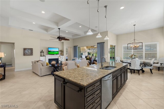 kitchen featuring an island with sink, sink, dishwasher, coffered ceiling, and pendant lighting