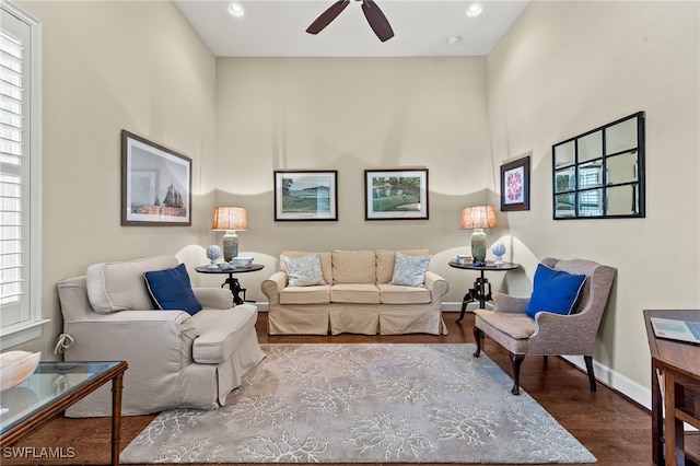 living room with hardwood / wood-style floors and ceiling fan