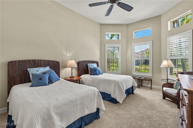 bedroom with light colored carpet and ceiling fan