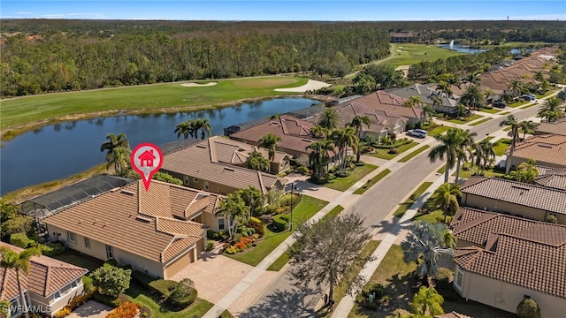 birds eye view of property with a water view