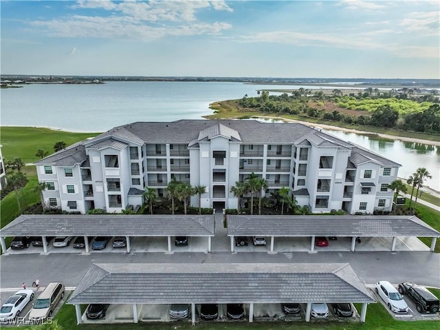 birds eye view of property with a water view