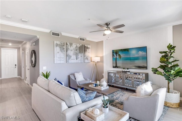 living room featuring ceiling fan and ornamental molding