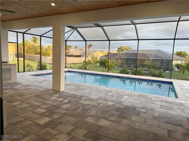 view of pool with a lanai and a patio area