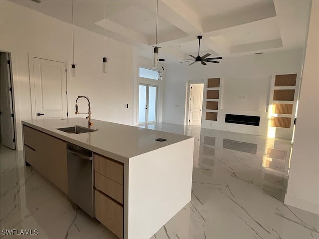 kitchen featuring sink, hanging light fixtures, coffered ceiling, an island with sink, and stainless steel dishwasher