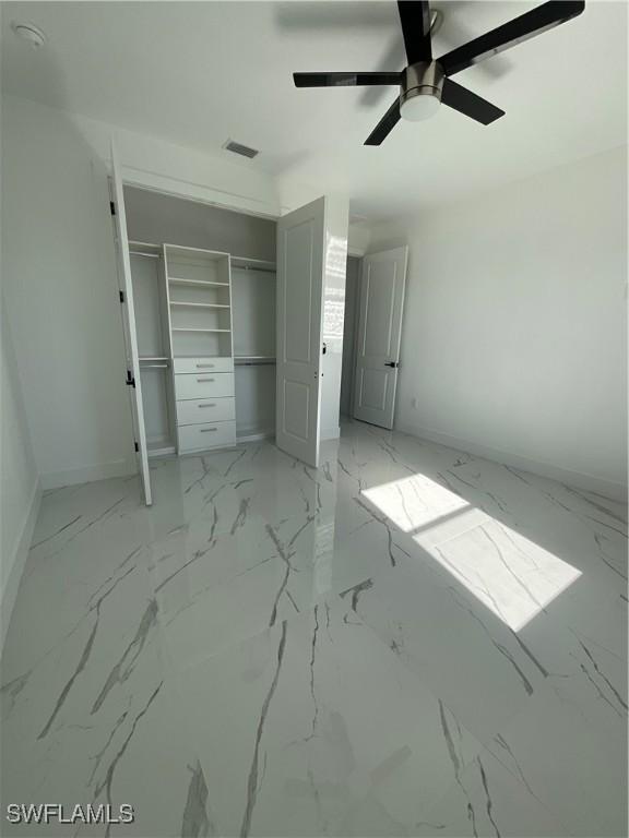 unfurnished bedroom featuring a closet and ceiling fan