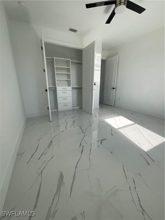 unfurnished bedroom featuring a closet and ceiling fan