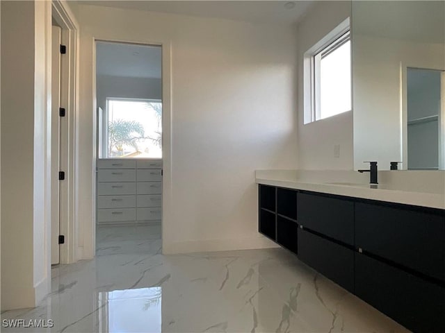 bathroom featuring vanity and a wealth of natural light