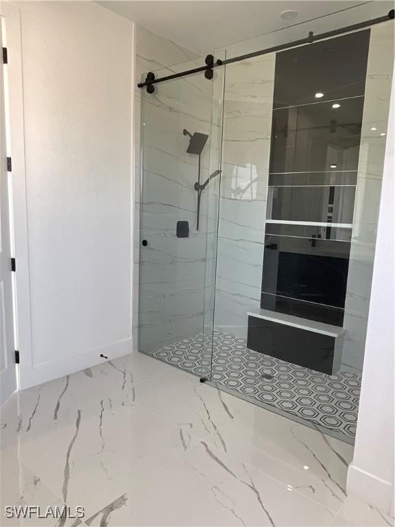 bathroom with a tile shower