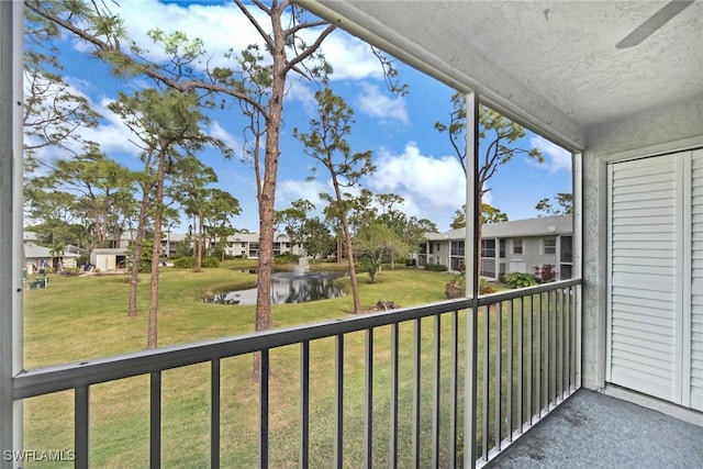 unfurnished sunroom with a water view