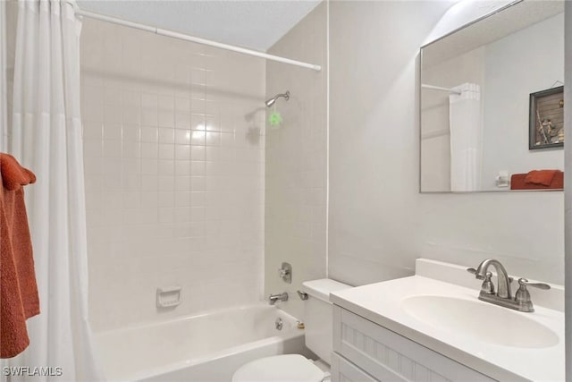 full bathroom featuring toilet, vanity, and shower / tub combo with curtain