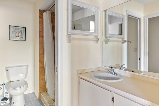 bathroom featuring toilet, walk in shower, vanity, and tile patterned flooring