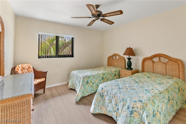 bedroom featuring light hardwood / wood-style floors and ceiling fan