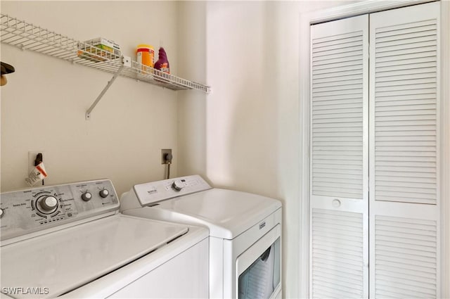 washroom with independent washer and dryer