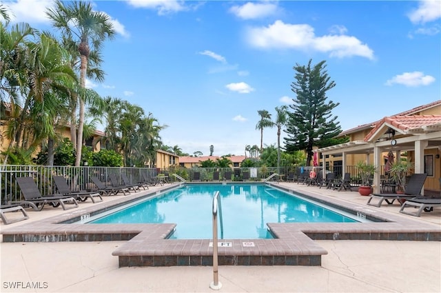 view of swimming pool with a patio area