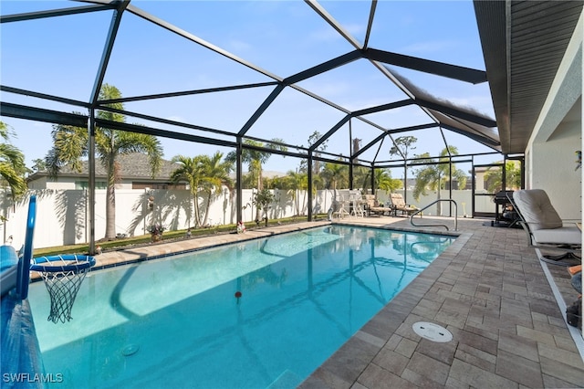 view of pool with a lanai and a patio area