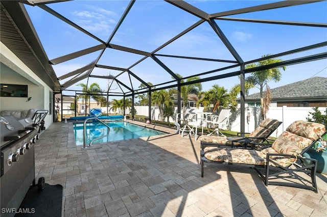 view of swimming pool with a lanai and a patio