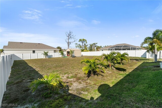 view of yard with a storage shed