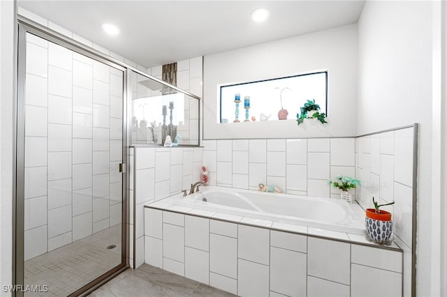 bathroom featuring plus walk in shower and tile patterned flooring