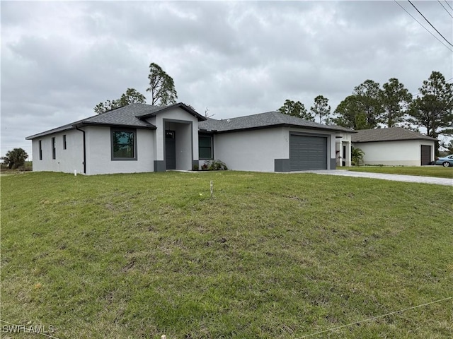 view of front of house with a front lawn and a garage