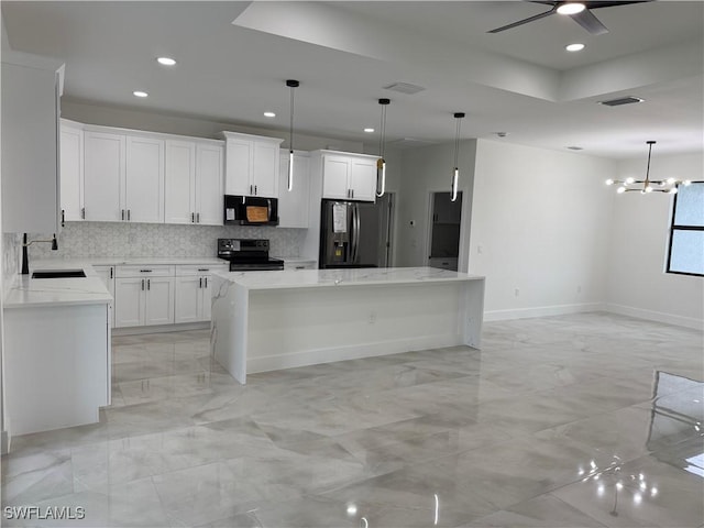 kitchen featuring a kitchen island, sink, white cabinets, and black appliances