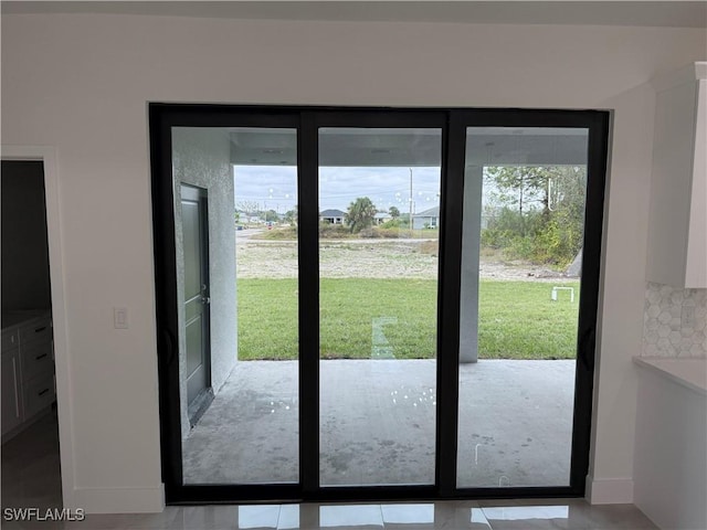 entryway featuring light tile patterned floors