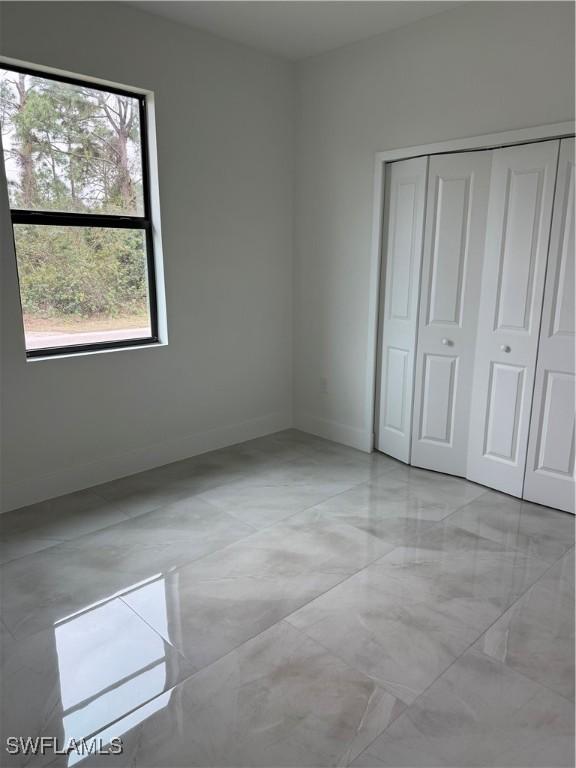 unfurnished bedroom featuring a closet