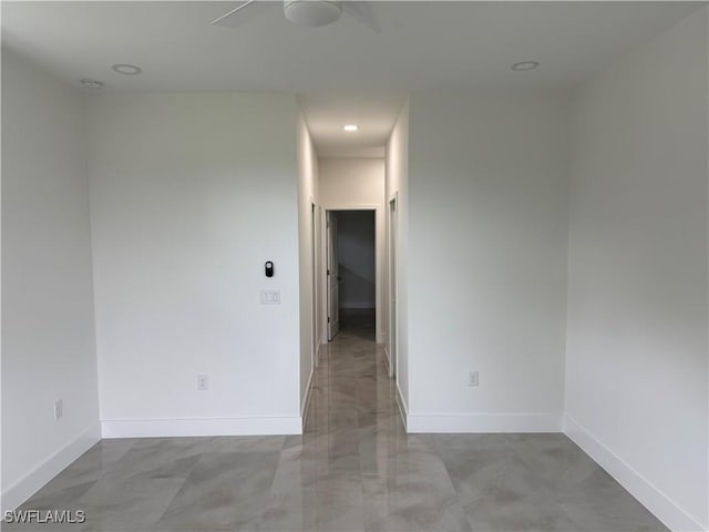 unfurnished room with ceiling fan