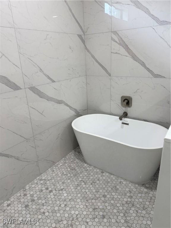 bathroom featuring a bathtub and tile patterned floors