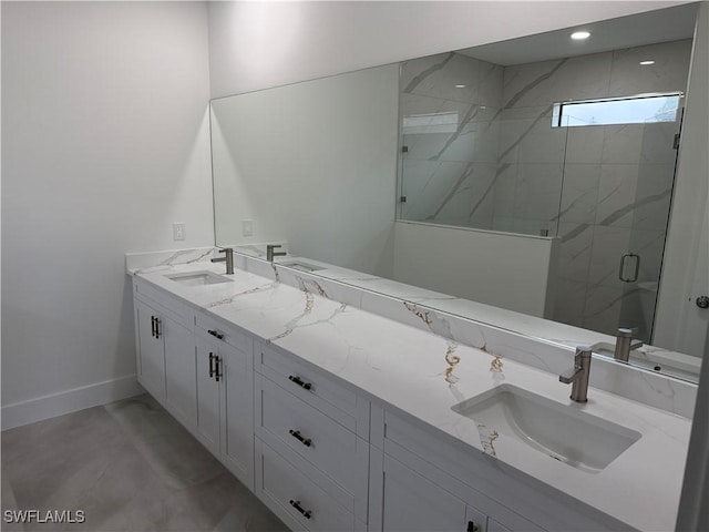 bathroom with an enclosed shower and vanity