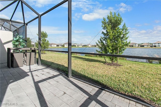 unfurnished sunroom with a water view