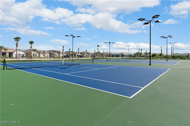 view of sport court featuring basketball hoop