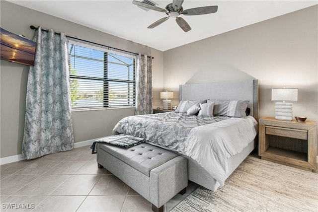 bedroom featuring ceiling fan and light tile patterned flooring