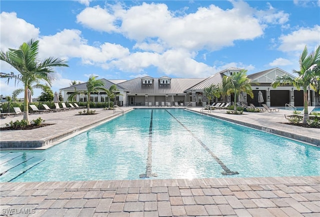 view of swimming pool with a patio