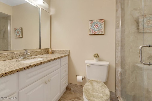 bathroom featuring a shower with shower door, tile patterned floors, toilet, and vanity