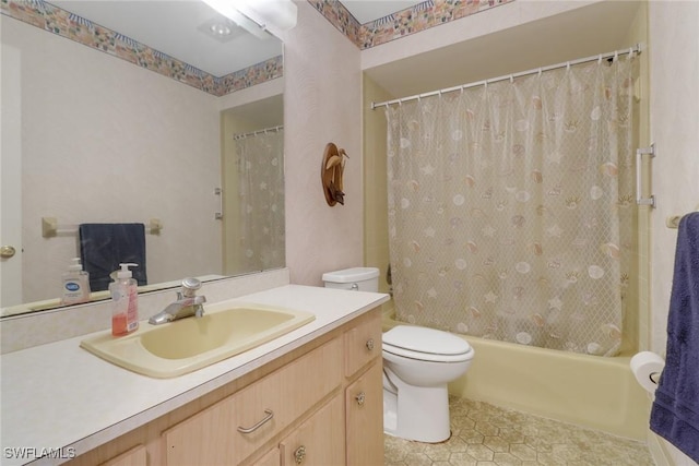 full bathroom with toilet, shower / bathtub combination with curtain, and vanity