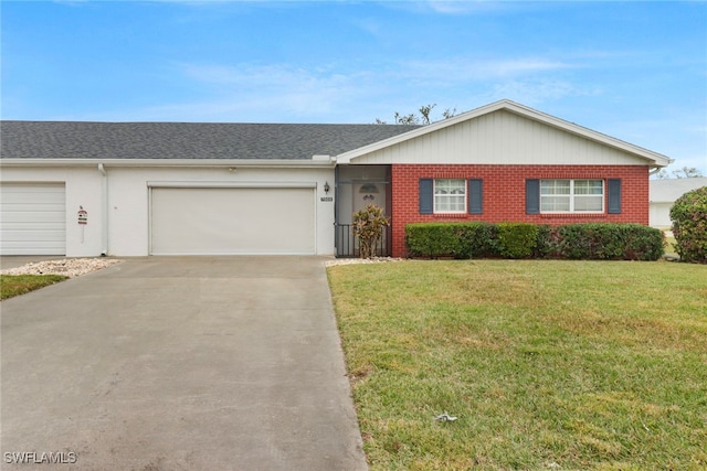 ranch-style home featuring a front yard and a garage