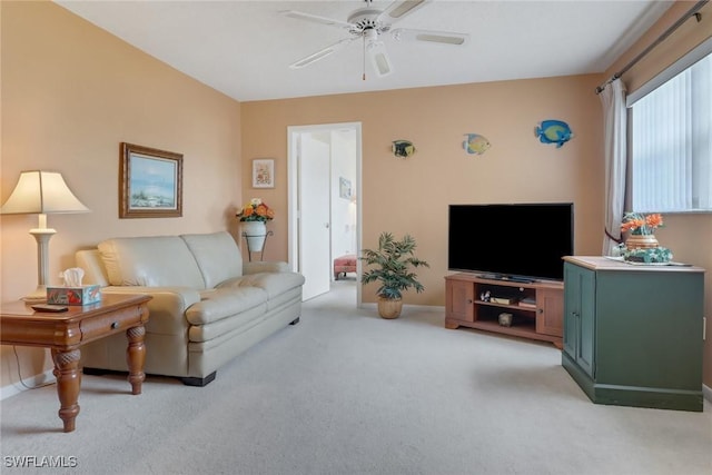 living room with ceiling fan and light carpet