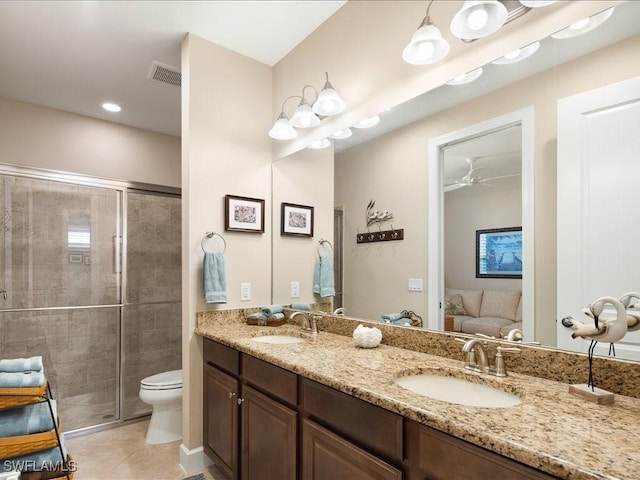 bathroom with ceiling fan, tile patterned floors, vanity, and a shower with shower door