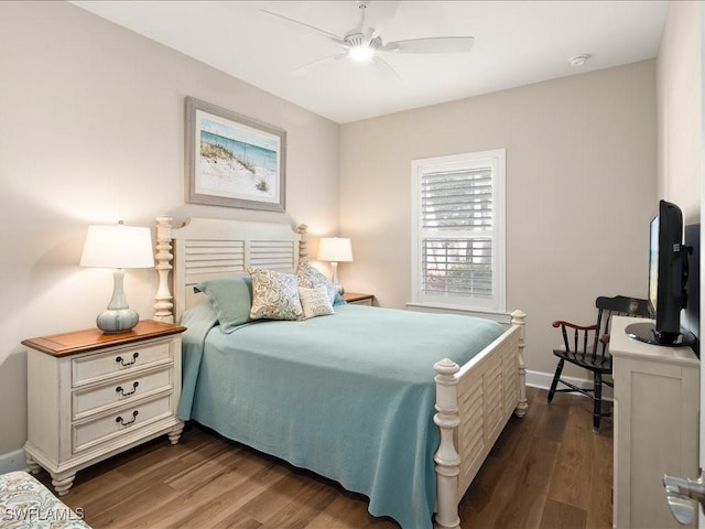 bedroom featuring ceiling fan and dark hardwood / wood-style floors