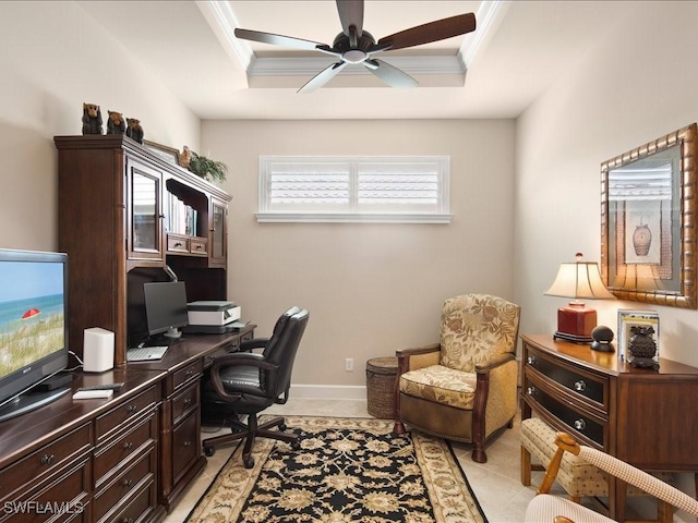 home office with light tile patterned flooring, ornamental molding, and a tray ceiling