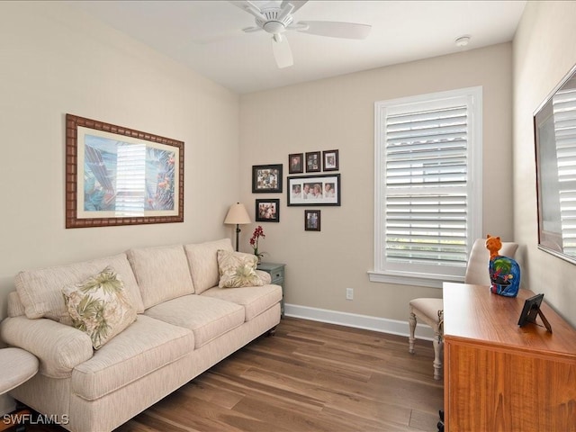 living room with ceiling fan and dark hardwood / wood-style floors