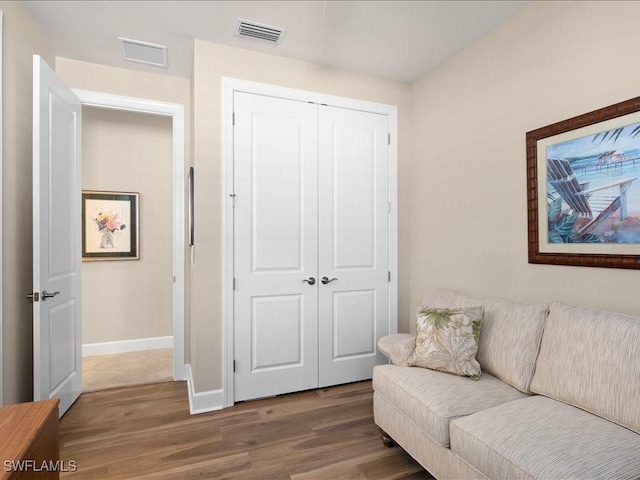 living area with wood-type flooring