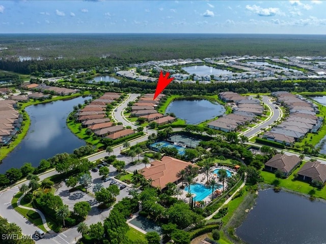 birds eye view of property with a water view