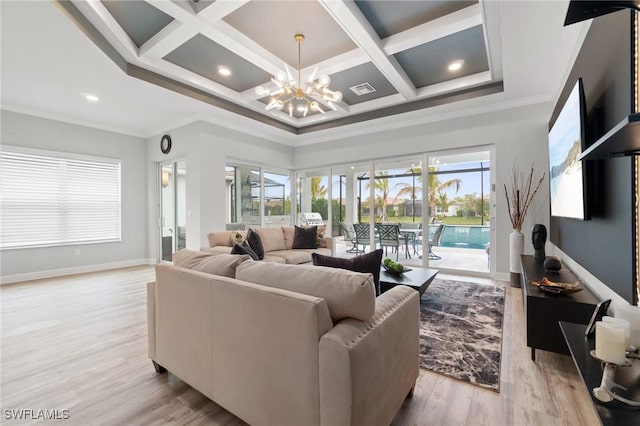 living room featuring crown molding, coffered ceiling, a chandelier, and light wood-type flooring