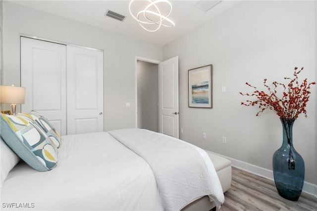 bedroom featuring light hardwood / wood-style floors and a closet